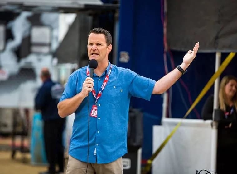 Jake Vanada preaching at the racetrack